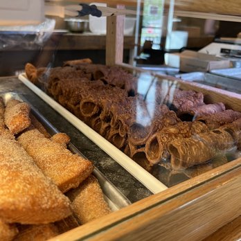 Crisp Cannoli - a variety of donuts in a display case - Bakeries Near Me - Greenbush, New York