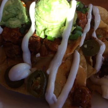 Veggie Grill by Next Level - Mondo Nachos, corn chips, taco blend, mashed avocado, VG-cheese, jalapenos, soy cream - Sandwiches Near Me - El Segundo, California