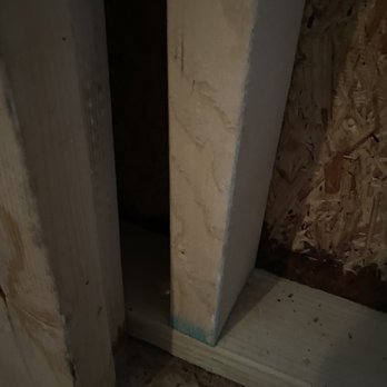 Absolute Garage Builders - Water damage and mold 5-6" from ground due to lack of plastic barrier between concrete and garage - Garage Door Services Near Me - Chicago, Illinois