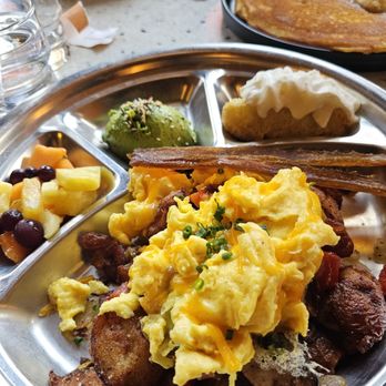 The Mercury Diner - Scrambled egg & cheese over their home fries, fresh fruit, avocado half, veggie bacon & Mercury cake. - Diners Near Me - Columbus, Ohio