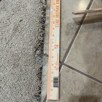 Phoenix Carpet - Before: Carpet is frayed where it meets the tile, with nails poking out. - Carpet Installation Near Me - Chicago, Illinois
