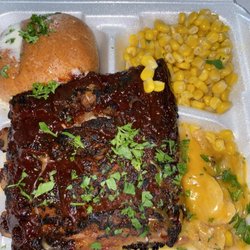Area 57 CoffeeCafe - Fire braised rib dinner with corn, buttered bun and some scalloped potatoes.