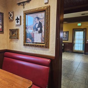 Mimi's Cafe - Art on Wall Depicting a French Waiter - American Near Me - Victorville, California Mimi's Cafe - Art on Wall Depicting a French Waiter - American Near Me - Victorville, California