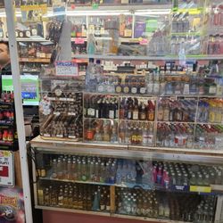 Kwik & Convenient Market - Wide selection of all liquor and cheaper than other neighrboring stores. Friendly staff.