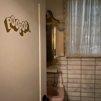 Corner Peach - a bathroom with a pink sink - Cafes Near Me - Ottawa, Ontario Corner Peach - a bathroom with a pink sink - Cafes Near Me - Ottawa, Ontario