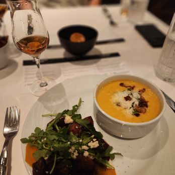 Fogo de Chão - Corn chowder and pork belly salad with bourbon glaze - Steakhouses Near Me - Glen Allen, Virginia