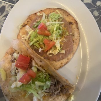 La Familia Prado - two tacos on a plate - Mexican Near Me - Torrington, Wyoming La Familia Prado - two tacos on a plate - Mexican Near Me - Torrington, Wyoming