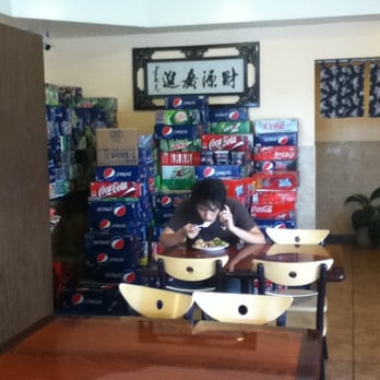 Ho Mei - Soda cases line the walls. Eating while gabbing on the cell phone is perhaps less gross than eating while texting. - Chinese Near Me - Wheat Ridge, Colorado