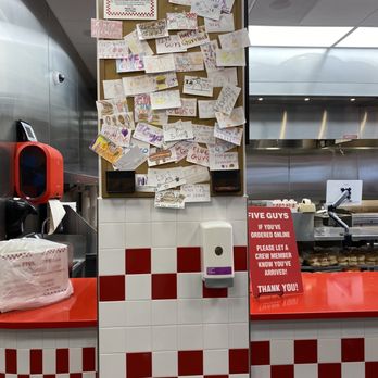 Five Guys - a kitchen with a red counter and red and white checkered counter - Burgers Near Me - Eden Prairie, Minnesota Five Guys - a kitchen with a red counter and red and white checkered counter - Burgers Near Me - Eden Prairie, Minnesota