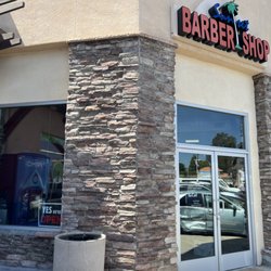 Sunset Barber Shop - Open sign in left window.