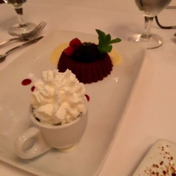 Ruth's Chris Steak House - Chocolate duo has a chocolate molten cake and chocolate mousse - Steakhouses Near Me - Cary, North Carolina Ruth's Chris Steak House - Chocolate duo has a chocolate molten cake and chocolate mousse - Steakhouses Near Me - Cary, North Carolina