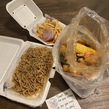 The Crab Pad - Quarantine special (mussels, shrimp, and fries with added potatoes and corn) & garlic noddles - Seafood Near Me - Chicago, Illinois The Crab Pad - Quarantine special (mussels, shrimp, and fries with added potatoes and corn) & garlic noddles - Seafood Near Me - Chicago, Illinois
