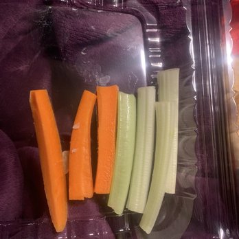 River Falls Restaurant - This is what comes with the "Buffalo chicken dip"... they didn't send me the extra celery I paid for, and the celery is colorless (gross) - Carrot and celery sticks are arranged in a clear plastic container, with carrots on the left and celery on the right. - Italian Near Me - Woonsocket, Rhode Island