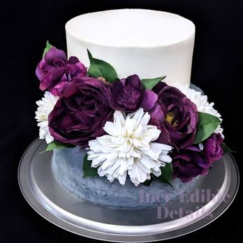 Incr-Edible Details - a white cake with purple and white flowers - Custom Cakes Near Me Incr-Edible Details - a white cake with purple and white flowers - Custom Cakes Near Me