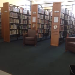 Kearny Public Library - Many shelves with books like any other library, but nice and bright with many windows.