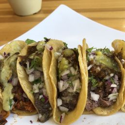 from left to right: Chorizo Verde, Chicharrón Prensado, Cachete, Moronga, Lengua, Cochinita Pibil from left to right: Chorizo Verde, Chicharrón Prensado, Cachete, Moronga, Lengua, Cochinita Pibil