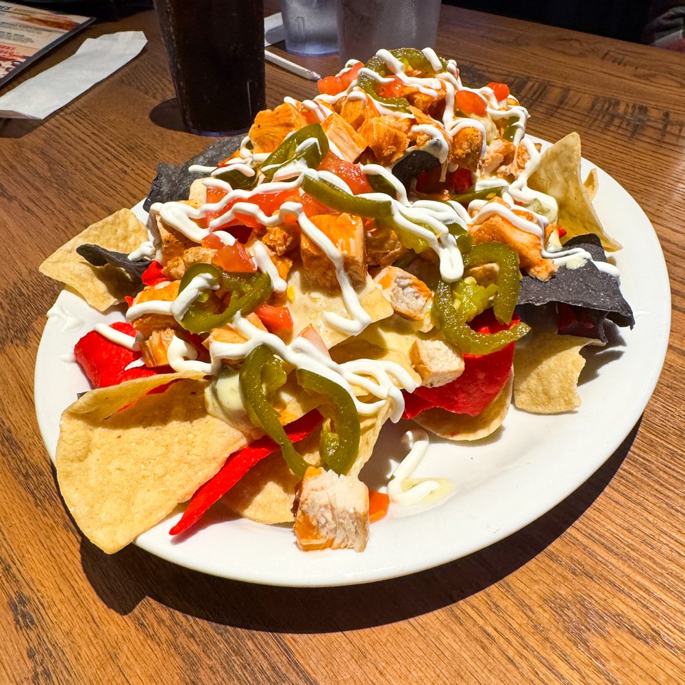 Buffalo chicken nachos with no olives ($15.99)