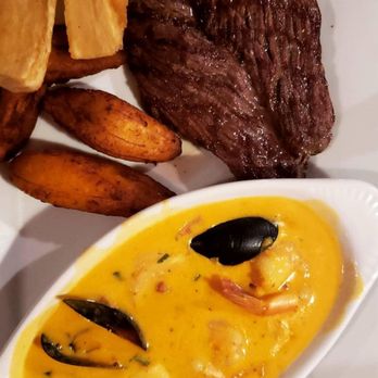 El Ceviche - Lomo a lo macho Great beef sirloin, with yuca and plantains. The shrimp & mussels in aji Amarillo sauce was amazing! - Cuban Near Me - Sarasota, Florida