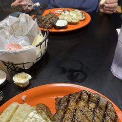 Jack's Steakhouse & Seafood - Steak, baked potato, and dinner rolls with strawberry butter.