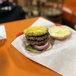 George's Giant Hamburger - Classic Triple patty with cheese.