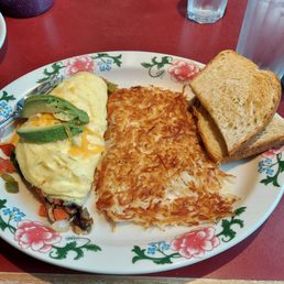 Vegetable omelet.  Hash browns and sour dough toast.