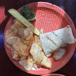 jeb's Restaurant - Chicken artichoke wrap on gluten free tortilla with chips and a pickle.