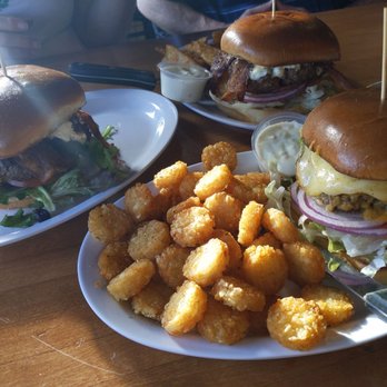 Garibaldi Portside Bistro - Left: Blueberry goat cheese burger. Farthest: Bacon Bleu burger Last but not least: Habanero mango burger with tots. - American Near Me - Garibaldi, Oregon Garibaldi Portside Bistro - Left: Blueberry goat cheese burger. Farthest: Bacon Bleu burger Last but not least: Habanero mango burger with tots. - American Near Me - Garibaldi, Oregon