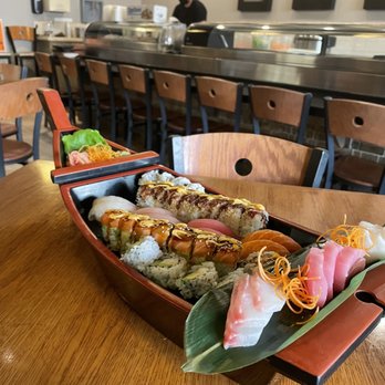 Sawatdee - a sushi boat on a table - Thai Near Me - Maple Grove, Minnesota Sawatdee - a sushi boat on a table - Thai Near Me - Maple Grove, Minnesota