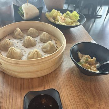 Dough Zone Dumpling House - Beaverton - Xiao Long Bao, Spicy Beef Sandwich, Pork Boiled Dumplings in spicy sauce, Romaine and spicy garlic dressing. - Dim Sum Near Me - Beaverton, Oregon Dough Zone Dumpling House - Beaverton - Xiao Long Bao, Spicy Beef Sandwich, Pork Boiled Dumplings in spicy sauce, Romaine and spicy garlic dressing. - Dim Sum Near Me - Beaverton, Oregon