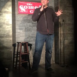 a man speaking into a microphone a man speaking into a microphone