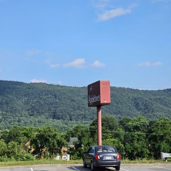 Applebee's Grill + Bar - The Applebee's red sign you can see as you are driving and the beautiful mountains in the background. - American Near Me - Roanoke, Virginia Applebee's Grill + Bar - The Applebee's red sign you can see as you are driving and the beautiful mountains in the background. - American Near Me - Roanoke, Virginia