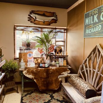 The Tin Trout - a room with a cow skin table and a cow skin chair - New American Near Me - Newland, North Carolina The Tin Trout - a room with a cow skin table and a cow skin chair - New American Near Me - Newland, North Carolina