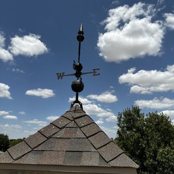 Griffin's Contracting - a weather vane on top of a roof - Roofing Near Me - Lubbock, Texas
