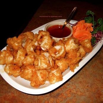 Buddha Ruksa - Calamari lightly dusted in rice flour then golden fried, served with sweet garlic-chili sauce. - Thai Near Me - Seattle, Washington