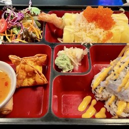 Lunch bento box with spicy tuna roll, shrimp tempura with mango roll, and lunch specials add ons