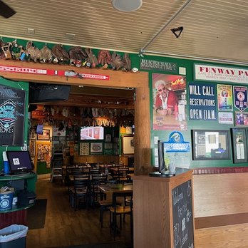Capones Pub & Grill - Interior another angle with baseball gloves and beer taps above the walkway - American Near Me - Coeur D Alene, Idaho Capones Pub & Grill - Interior another angle with baseball gloves and beer taps above the walkway - American Near Me - Coeur D Alene, Idaho