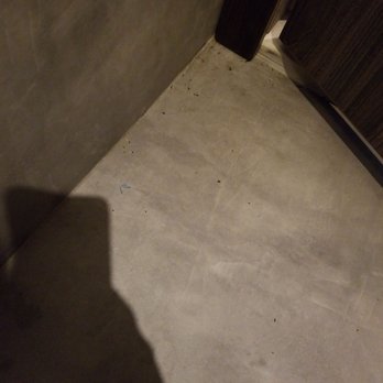 The Oriental Hotel - Bathroom floor, unswept with more bugs and (other) human hair. - Resorts Near Me - Legazpi City, ALB