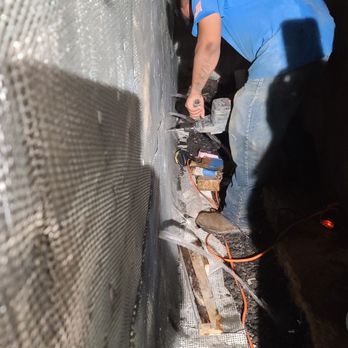 Basement Waterproofing Specialists - Draining the water from the wall - Waterproofing Near Me - Collegeville, Pennsylvania