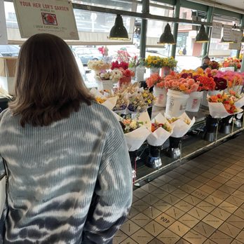 Pike Place Flowers - C in her element.  Fresh flowers to make her own arrangements. We left flowers behind for housekeepers from this point forward on our trip. - Florists Near Me - Seattle, Washington