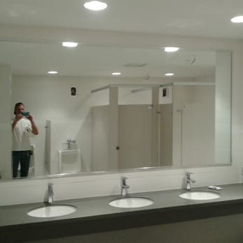 A Touch Of Glass - 96X48 Mirror suspended in the middle of the wall with light cutouts - General Contractors Near Me A Touch Of Glass - 96X48 Mirror suspended in the middle of the wall with light cutouts - General Contractors Near Me