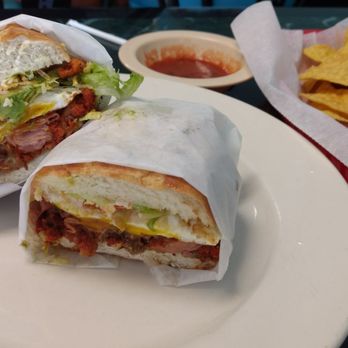 Michoacan Mexican Restaurant - Torta Cubana, featuring grilled meats, hot dog, fried egg, and avocado - Mexican Near Me - Durham, North Carolina Michoacan Mexican Restaurant - Torta Cubana, featuring grilled meats, hot dog, fried egg, and avocado - Mexican Near Me - Durham, North Carolina