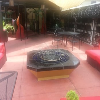 Byblos - Outdoor patio at Byblos Café. Outdoor fire pits with sofas, chairs, and hookah pipes. - Mediterranean Near Me - Tampa, Florida Byblos - Outdoor patio at Byblos Café. Outdoor fire pits with sofas, chairs, and hookah pipes. - Mediterranean Near Me - Tampa, Florida