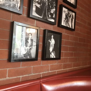 Fuddruckers - a wall of family photos - American Near Me - Miami, Florida Fuddruckers - a wall of family photos - American Near Me - Miami, Florida