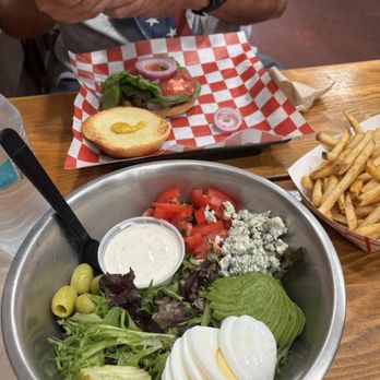 Outlaw Grille - Cobb salad without the bacon (vegetarian) Classic Hamburger and seasoned fries - Salad Near Me - Sedona, Arizona Outlaw Grille - Cobb salad without the bacon (vegetarian) Classic Hamburger and seasoned fries - Salad Near Me - Sedona, Arizona