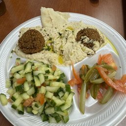 Not as many vegan/vegetarian options as I would have liked, but the food is delicious. I got the falafel, with hummus and cucumber salad. Not as many vegan/vegetarian options as I would have liked, but the food is delicious. I got the falafel, with hummus and cucumber salad.