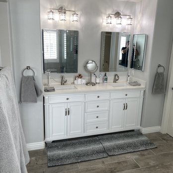 Nochis Construction - This is the "After" of the new vanity, flooring, lighting, mirrors, and hardware they installed. - General Contractors Near Me - Lake Elsinore, California