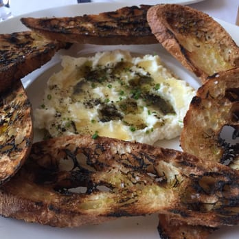Red Feather Kitchen - Whipped ricotta with truffle and honey, served with grilled baguette. - New American Near Me - Cincinnati, Ohio Red Feather Kitchen - Whipped ricotta with truffle and honey, served with grilled baguette. - New American Near Me - Cincinnati, Ohio