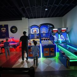 Basketball, skee ball, and air hockey arcade games.