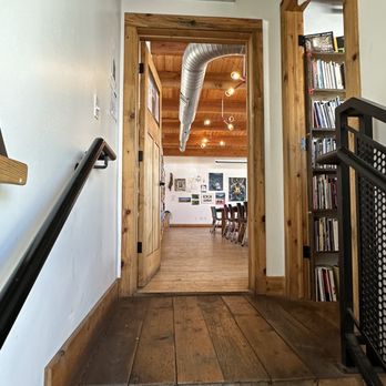 Wolverine Farm Publick House - Second floor meeting space and shelves of books - Venues & Event Spaces Near Me - Fort Collins, Colorado