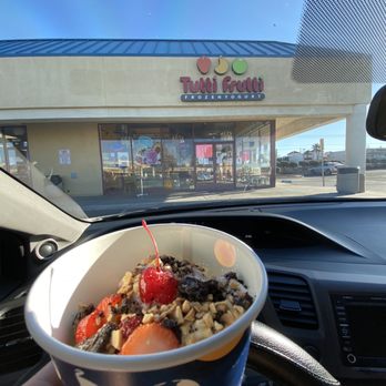 Tutti Frutti - a hand holding a cup of food - Ice Cream & Frozen Yogurt Near Me - Victorville, California Tutti Frutti - a hand holding a cup of food - Ice Cream & Frozen Yogurt Near Me - Victorville, California